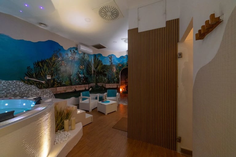 Modern indoor spa and wellness center with illuminated pools, decorative plants, wooden wall panels, and contemporary furnishings